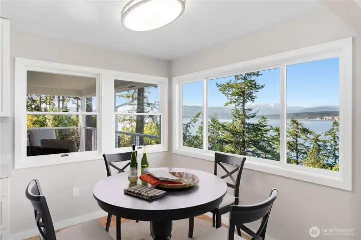 Charming breakfast nook off the kitchen with stunning water and mountain views.