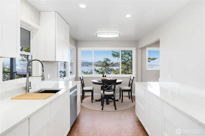 Beautiful views out every window in the kitchen. The cabinet hardware has been installed since this photo was taken.