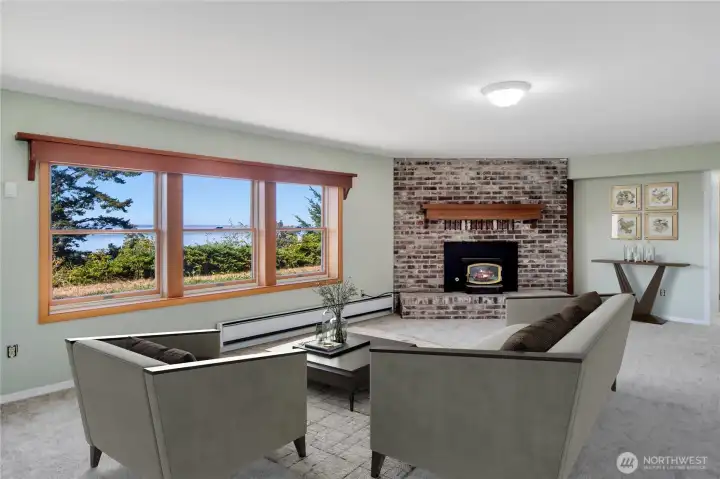 The lower level family room is off of the lower kitchen. It has great views of the water and mountains.