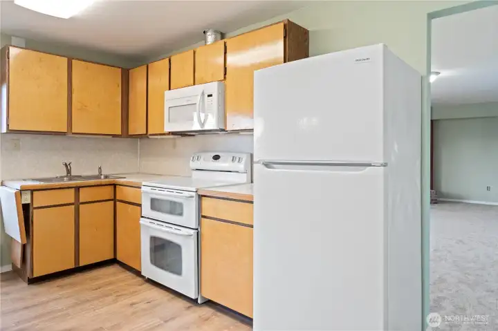 Second eat-in kitchen ideal for multigenerational living or entertaining, featuring beautiful water and mountain views.