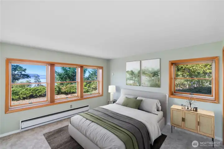 Lower-level bedroom with beautiful water and mountain views, conveniently located near a 3/4 bath.
