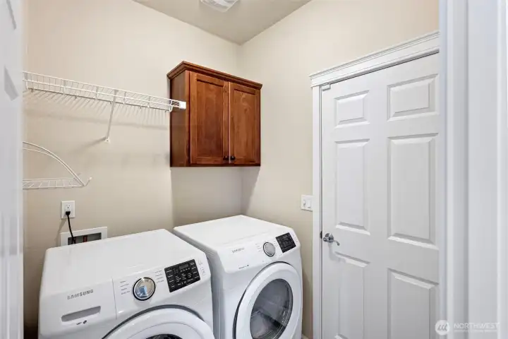 Laundry/mudroom between kitchen and garage.