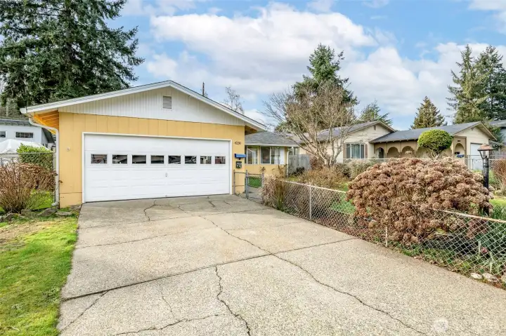 2 car attached garage, driveway parking plus additional room for vehicles.