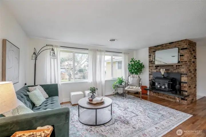 Eastern exposure living room windows soak the space in natural light.