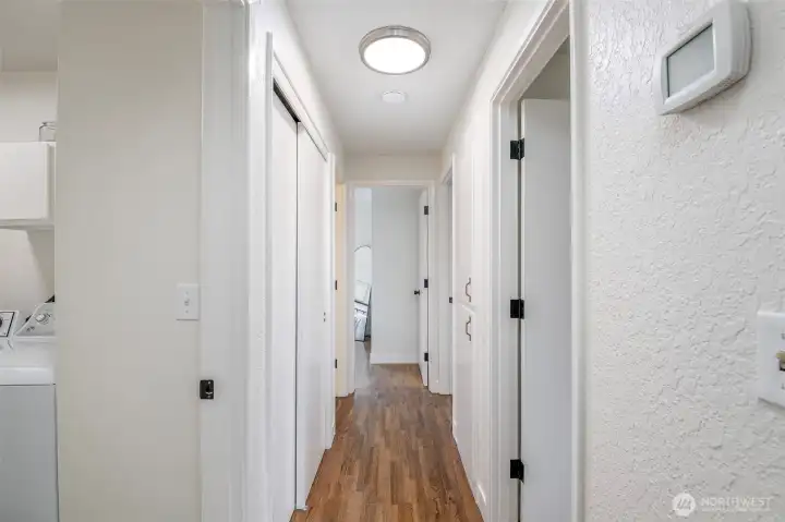 Hallway features a full size storage closet with double sliding doors.