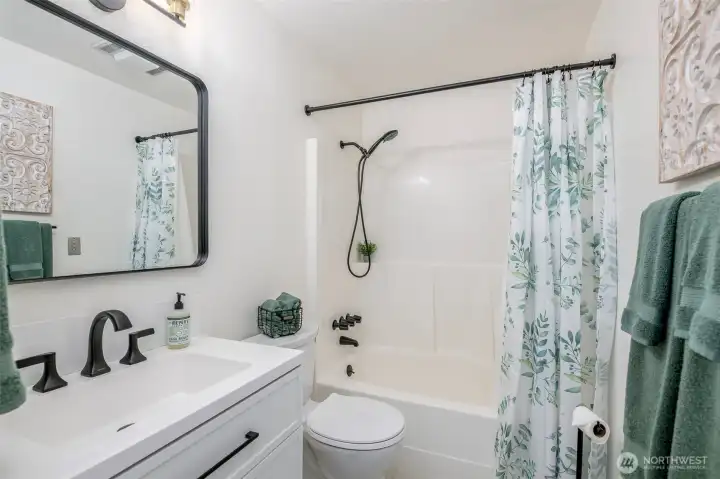 Timeless updates in the full bath, including Duralux flooring.