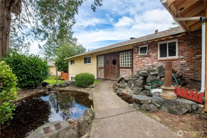 Entrance with pond and water feature