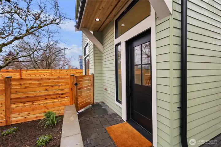 Main entry with gated access to front courtyard