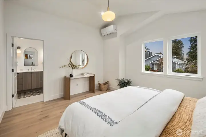 Primary suite showing access to bathroom