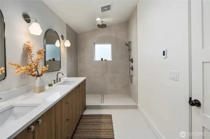 Spacious tiled bath with rain-head. Partial glass wall to be installed