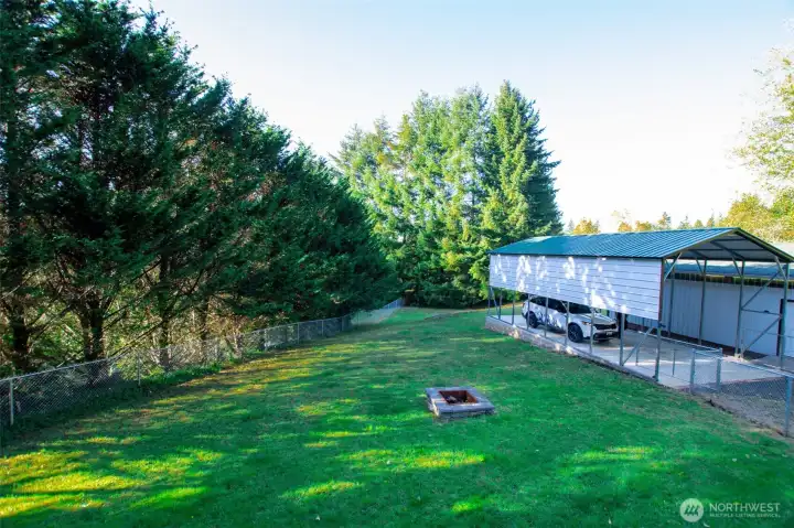 Lovely fenced extension of backyard w/ fire pit