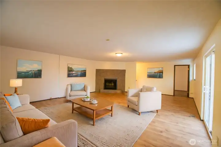 Virtually Staged - Upper Floor Huge Rec/flex space with another bedroom in the distance.  Doors to upper deck overlooking backyard