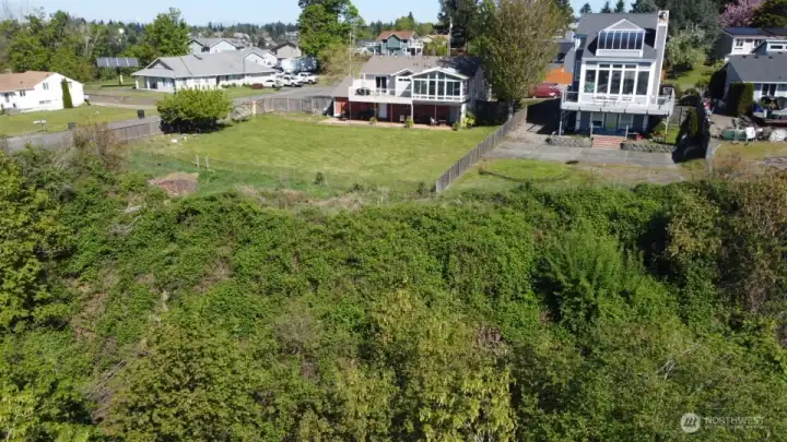 Endless Possibilities or Just leave As Is....You can move your back fence and clear the brush if you choose