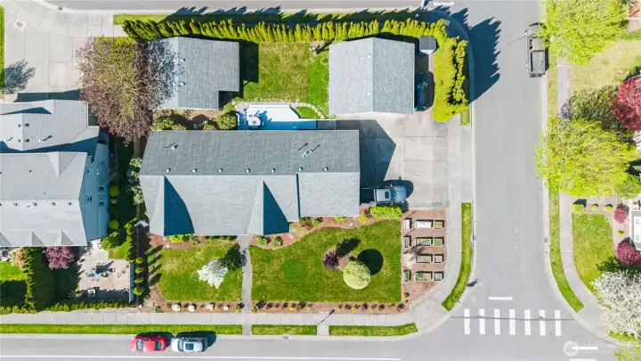 Aerial view of home on 1/3 acre corner lot.