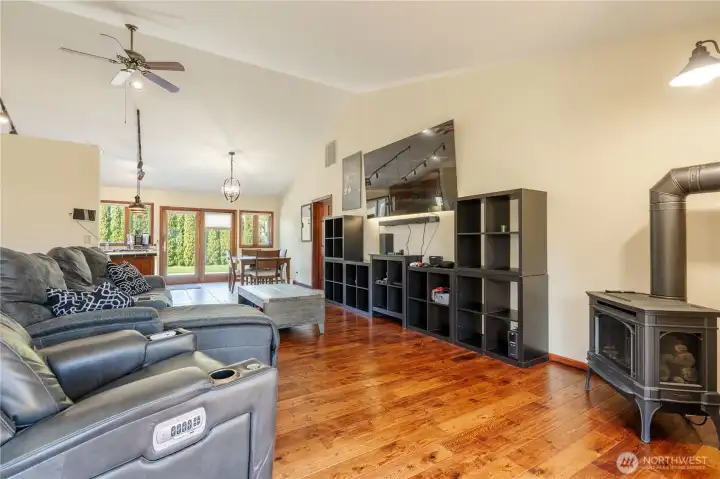 Vaulted ceiling in the living, dining and kitchen areas creates a very spacious feeling in this great room floorplan.