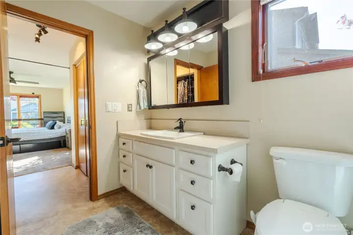 Primary bathroom looking towards double closets