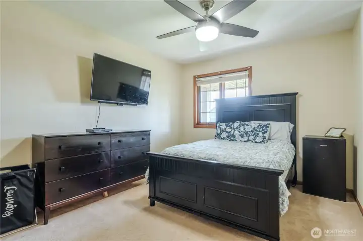 Third bedroom with wood blinds.