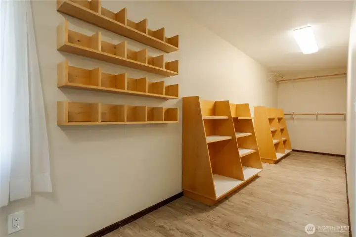 Storage area / flex space at east side of home. Use as pantry/seasonal storage, or any of your winter equipment, suitcases, etc.