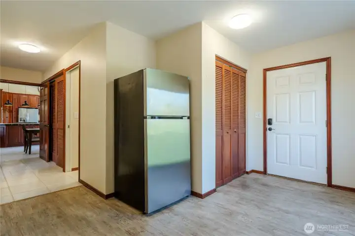 Back entrance a few steps from the garage. Perfect for mud room and as you can see tons of storage.