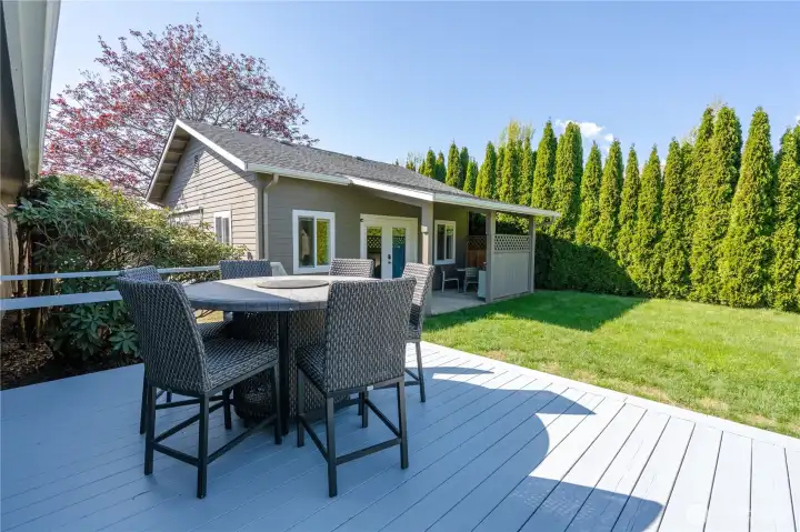 Large back deck looks on to private backyard.