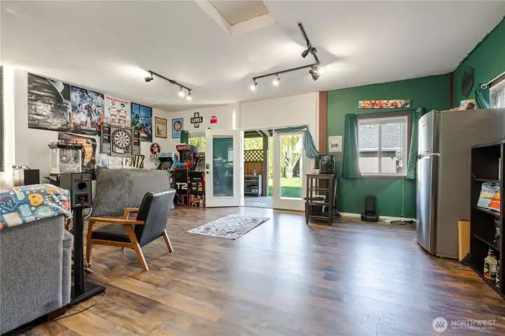 Another view of the interior of the studio looking out to the back yard and porch
