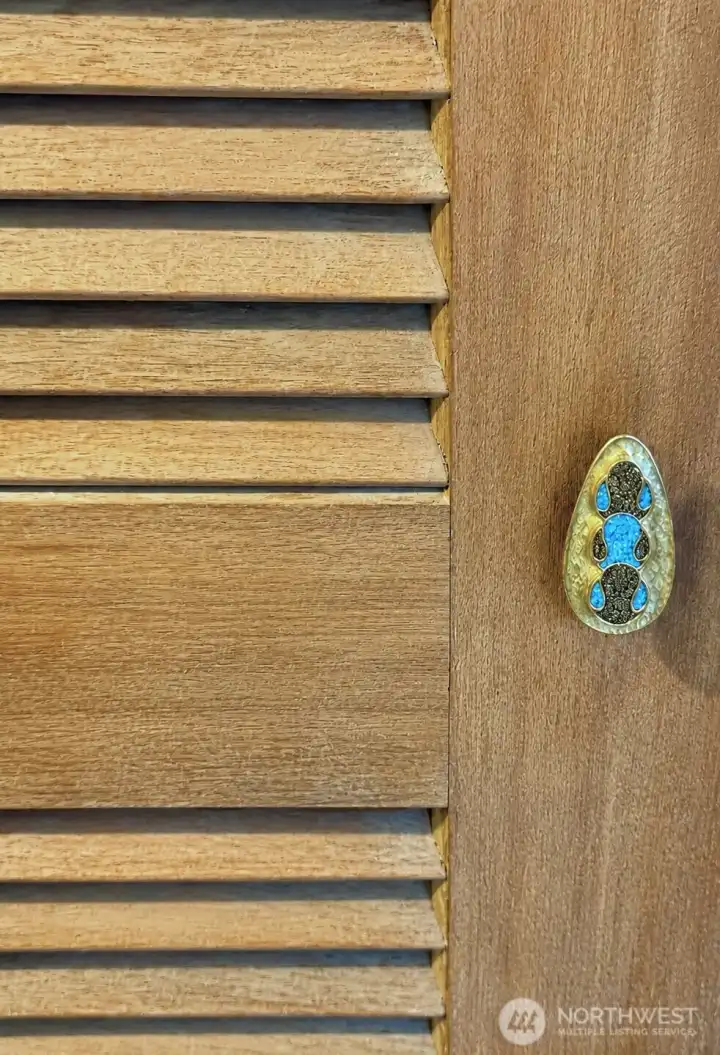 Original mahogany doors with gemstone pulls.