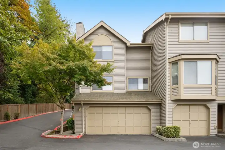 Welcoming end-unit townhome in desirable Larkspur Landing community with ample guest parking.