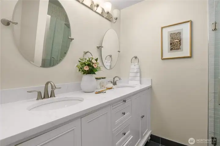 Primary ensuite bath with dual sinks and generous counter space