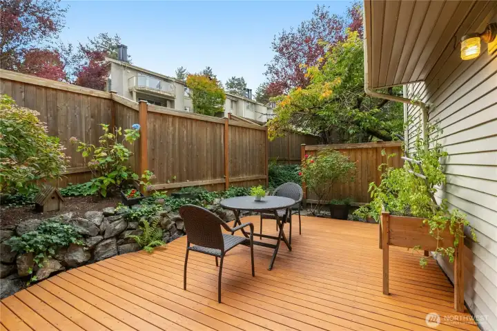 Private deck overlooking fenced backyard—perfect for outdoor dining