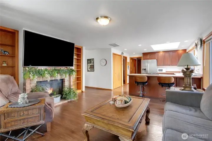 Family room w/gas fireplace, continuous wood flooring