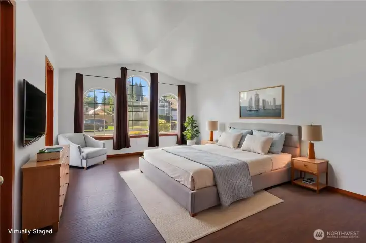 Primary bedroom so bright with floor to ceiling windows, virtually staged