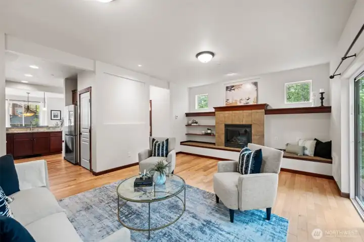 Light and bright layout with hardwood floors throughout main level and a cozy gas fireplace.
