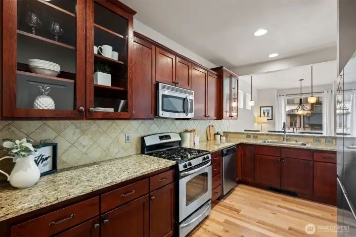 Amazing kitchen with plenty of counter space, glass panel cabinetry, and tons of storage for all your special cookware.