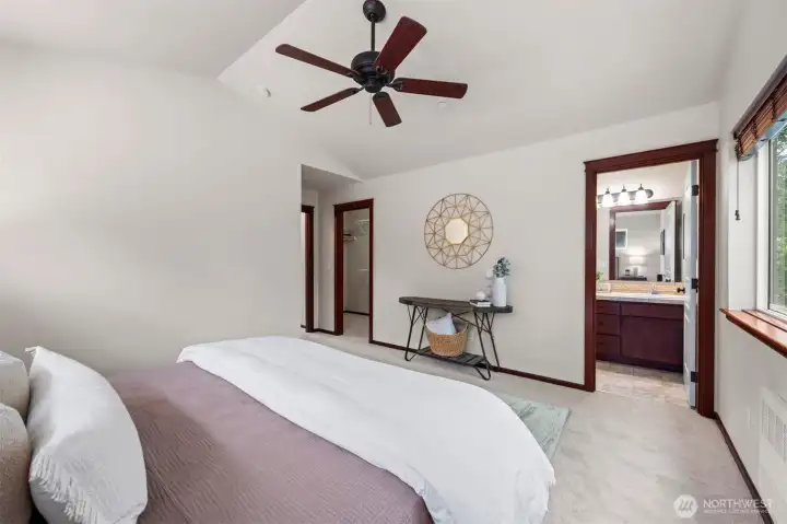 The primary suite has a walk-in closet and en-suite full bath with double sinks.