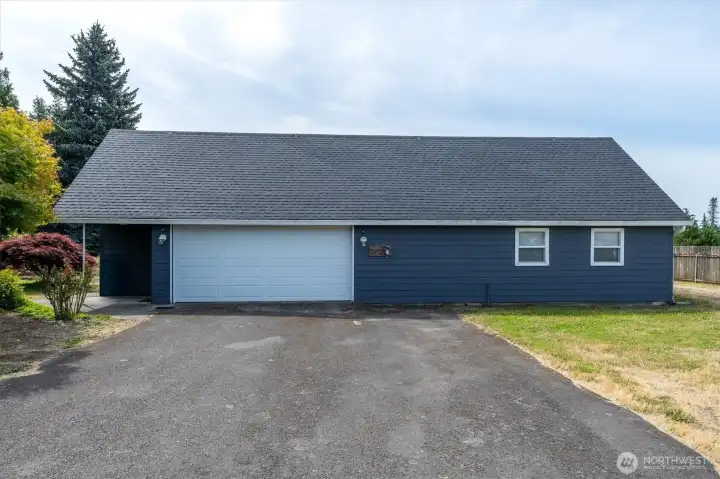 Garage has new door and opener.