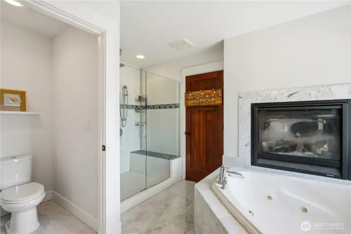 double sided fireplace, jetted tub and walk in shower