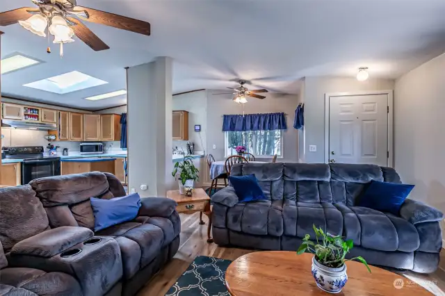 Living areas have ceiling fans. Skylight in kitchen. Vaulted ceilings.