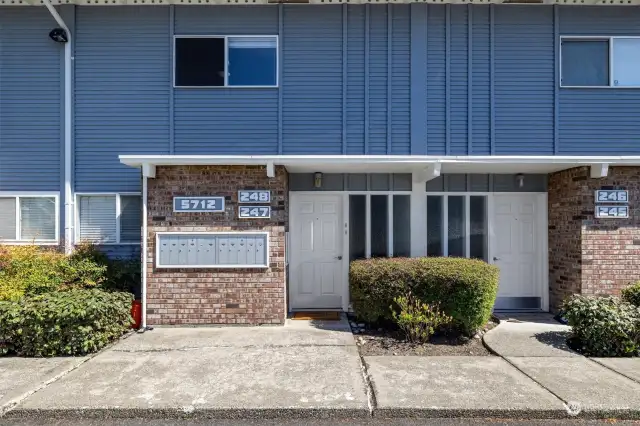 Welcome home to 5712 122th Pl SE, #248, Bellevue, a second-floor condo in Newport Hills. An excellent location, with Bellevue schools and easy commutes. Through this door climb the stairs to the front door of the unit - both doors with locks for added security.
