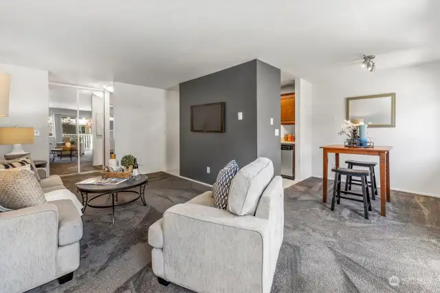 No need to sacrifice living space for eating when you have a dedicated dining room! Quick access to the kitchen - behind the TV wall - from both ends.