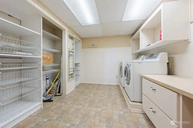 Wow, look how huge this laundry room is. Great storage.