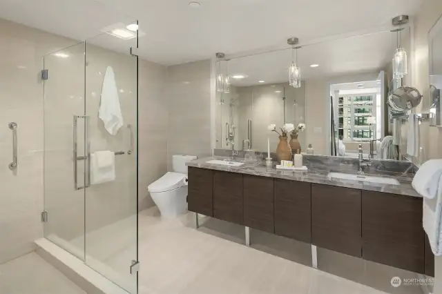 Your generous ensuite bath offers dual sinks & large walk-in shower with glass surround.