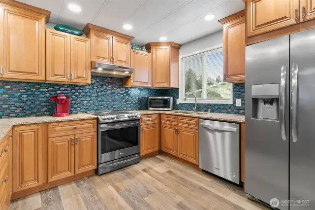 Fantastic kitchen with stainless steel appliances and granite countertops.