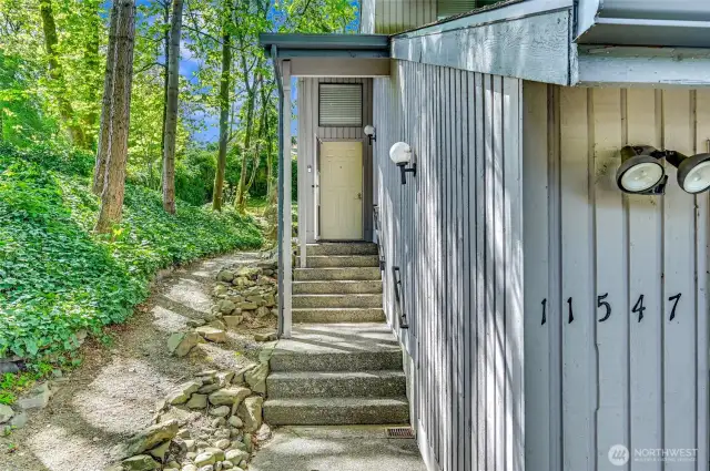 Welcome to your end unit town house surrounded by lush greenery, a private garage, and private entry. This two story duplex style town house walks and feels like a single family residence.