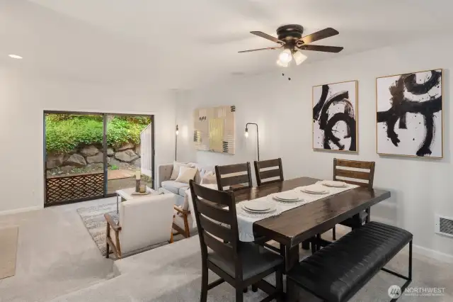 Walk out to the private patio from your spacious living room. virtually staged