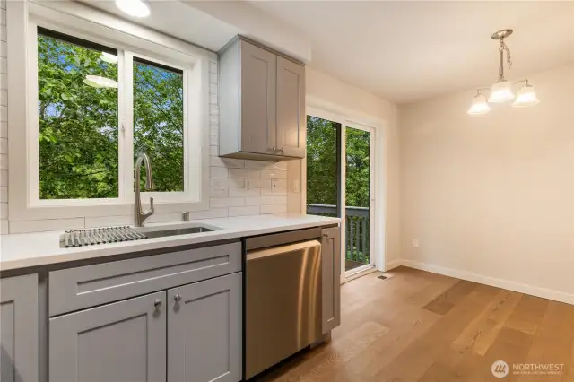 Kitchen looking toward dinning room and slideer to back deck