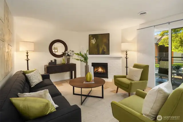 Spacious living room with wood-burning fireplace.