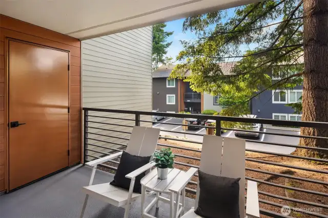 Sip your coffee on this perfectly shaded deck with a generous storage room to the side