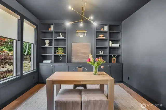 Large main floor office/bedroom w/custom built-ins, large closet & floor outlet