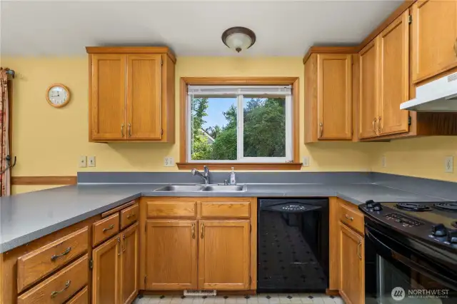 Another view of the kitchen which looks out over the private backyard.