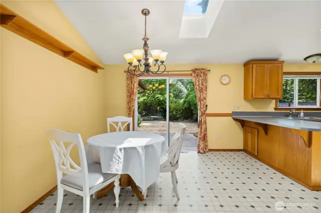 Dining area with another skylight.  This house lives so light and bright!